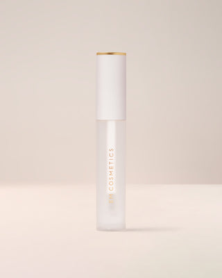 EM Cosmetics Morning Dew Crystal Lip Gloss in Quartz shown closed in its clear tube with a modern white cap.