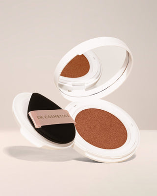 EM Cosmetics Daydream Cushion Foundation with SPF in Warm Dusk, a tan shade with warm undertones for a radiant complexion.