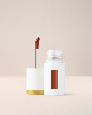 EM Cosmetics Everglass Lip Dew in Secret, a warm toffee nude, a long-wearing lip lacquer with a glassy, vinyl finish.