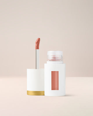 EM Cosmetics Everglass Lip Dew in Enchant, a warm rose, a high-shine lip lacquer for a juicy, vinyl-like pout.