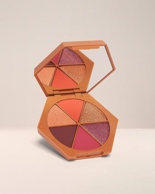 EM Cosmetics Divine Skies Eyeshadow Palette in Faded Clementine, a warm 6-pan palette of peachy and brown tones.