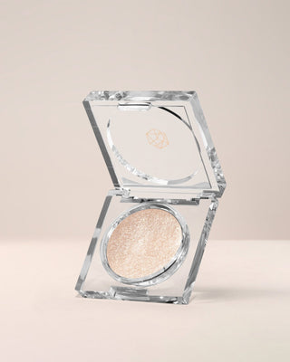 EM Cosmetics Cosmic Pearl Dewy Eyeshadow in Luna, a shimmering champagne shade for a radiant, wet-look, dewy eye.