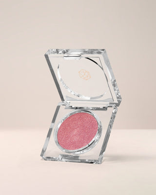 EM Cosmetics Cosmic Pearl Dewy Eyeshadow in Starchild, a shimmering taupe for a sophisticated, pearlescent gaze.