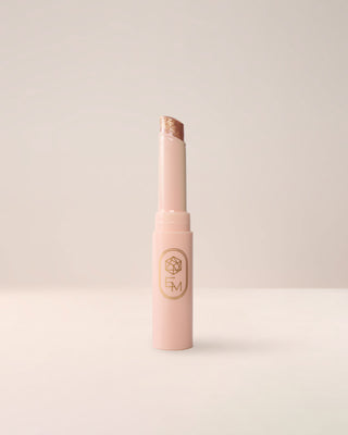 EM Cosmetics Three Wishes Glitter Wand in Gold, a high-shine liquid glitter for eyes.