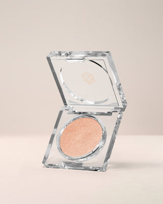 EM Cosmetics Cosmic Pearl Dewy Eyeshadow in Wish, a sparkling peach for a bright, pearlescent, wet-look eye.