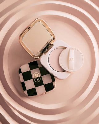 A texture swatch of EM Cosmetics Portrait Mode Powder demonstrating its ultra-fine translucent finish