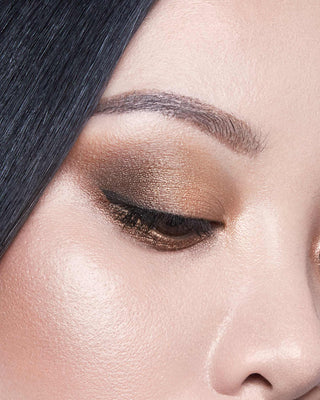 Michelle Phan wearing EM Cosmetics Divine Skies Palette in Da Vinci, creating a defined, warm brown eye makeup look.