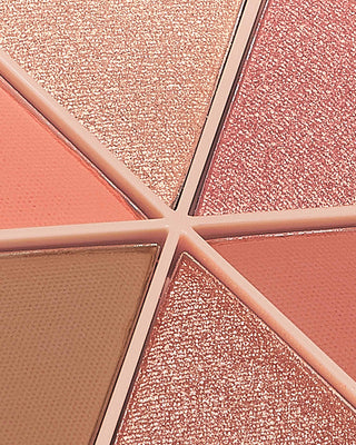 Arm swatches of EM Cosmetics Divine Skies Palette in Magic Hour showing the pigmented textures.