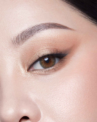 Michelle Phan wearing EM Cosmetics Divine Skies Palette in Rodin, creating a soft, sculpted cool-toned eye look.