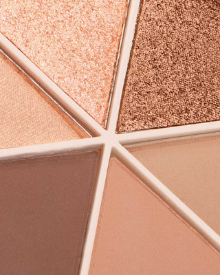 Arm swatches of EM Cosmetics Divine Skies Eyeshadow Palette in Rodin, showing the pigmented cool-toned rose shades.