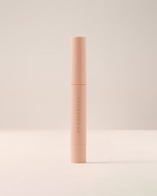 EM Cosmetics Lip Cushion Tinted Lip Luminizer in Magic Hour in its closed packaging.