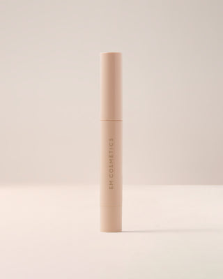 EM Cosmetics Lip Cushion Tinted Lip Luminizer in Mona Lisa, shown in its sleek, color-coordinated packaging.