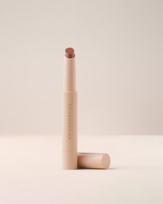 EM Cosmetics Lip Cushion Tinted Lip Luminizer in Mona Lisa, a soft nude brown shade, shown open to reveal the product.
