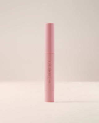 EM Cosmetics Lip Cushion Tinted Lip Luminizer in Mystic in its closed packaging.