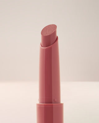 Close-up texture shot of EM Cosmetics Lip Cushion in Venetian Rose showing the glossy finish.