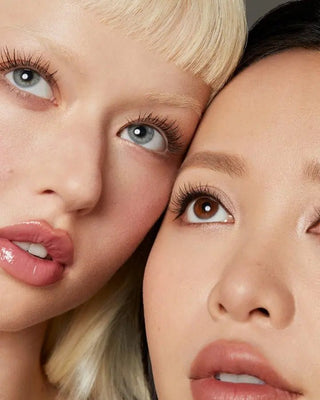Michelle Phan and a model both wearing EM Cosmetics Shapeshift Mascara