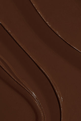 Texture swatch of EM Cosmetics So Soft Multi-Faceplay in Nomadic, showing the creamy bronzing formula.