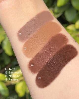 Arm swatches of EM Cosmetics So Soft Multi-Faceplay contour shades, including the neutral Terra.