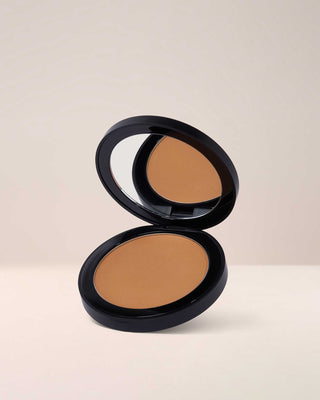EM Cosmetics Corselette Sculpting Bronzer in Sensual, a soft neutral bronzer, shown in its open compact.