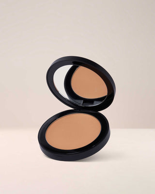 EM Cosmetics Corselette Sculpting Bronzer in Slip, a light soft bronzer, shown in its open compact.