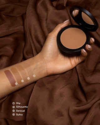 Arm swatches of EM Cosmetics Corselette Sculpting Bronzer in Sensual, showing the soft, matte powder texture.