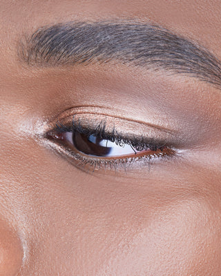 Male model wearing EM Cosmetics Cosmic Pearl Eyeshadow in Wish, enhancing the eyes with a warm beige glow.