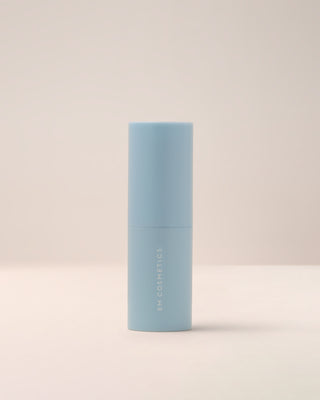 The portable, chic white packaging of the EM Cosmetics Face Cuddle Moisture Balm, perfect for on-the-go hydration.