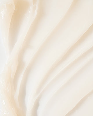 Swatch of EM Cosmetics Face Cuddle Moisture Balm, showing its clear, dewy texture that provides an instant glassy glow.