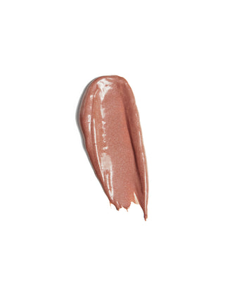 Arm swatch of EM Cosmetics Lip Cushion in Mona Lisa, demonstrating the sheer, luminous tinted finish.