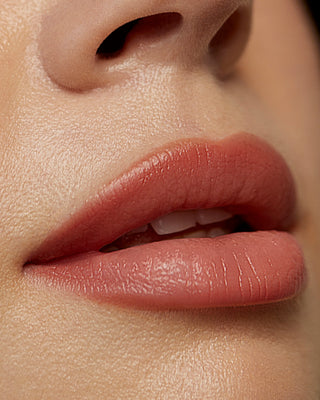 Model Anna wearing EM Cosmetics Soft Blur Velvet Lip Liner in Bunny for a natural lip definition.