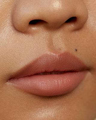 Model Valerie wearing EM Cosmetics Soft Blur Velvet Lip Liner in Fawn for a natural finish.