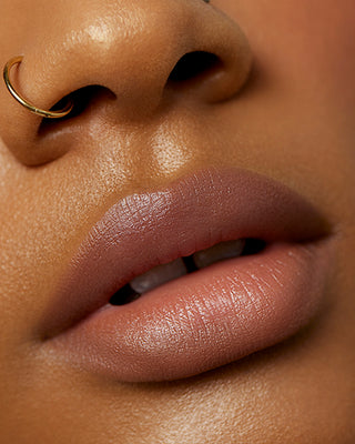 Model Tamika wearing EM Cosmetics Soft Blur Velvet Lip Liner in Mink for a natural matte look.